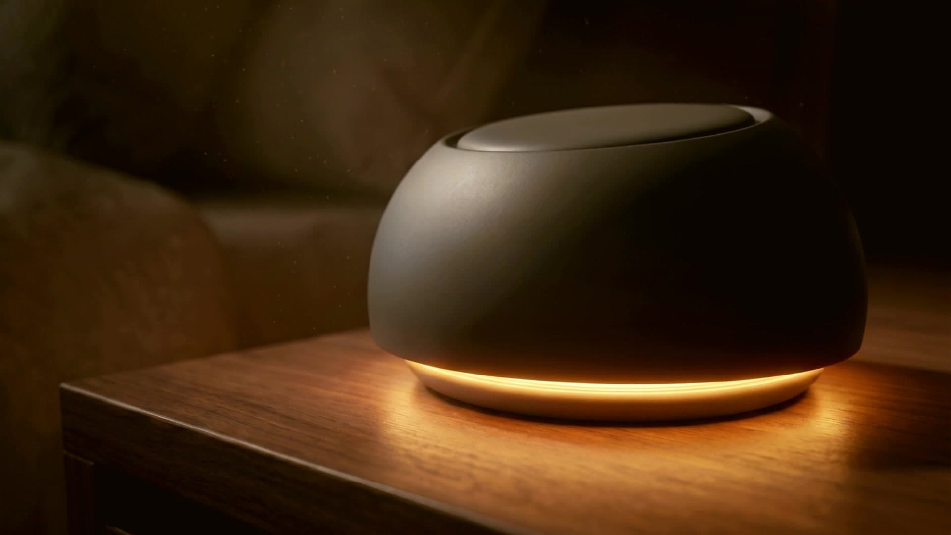 Aurora Lumen alarm clock glowing on a walnut nightstand
